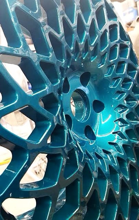 Powder coated wheel in metallic teal